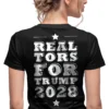 Woman realtor wearing black Realtors for Trump 2028 T-Shirt - Unisex pro-Trump patriotic graphic tee for real estate professionals on female model